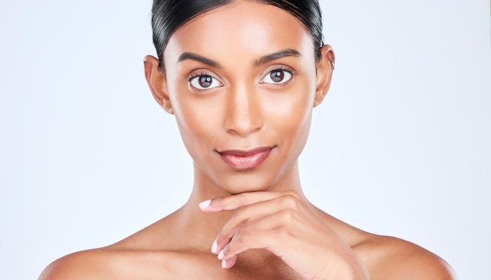 Studio portrait of Indian woman for dermatology, skincare and cosmetics for salon aesthetic. Beauty.